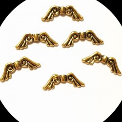 Metāla starplika - pērle spārni, ant.zelta (x1)